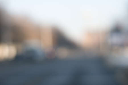 Traffic abstract background with blurry buildings, street signs and carsの写真素材