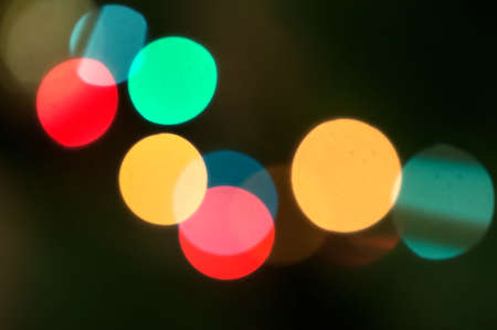 Christmas lights defocused background on fir tree