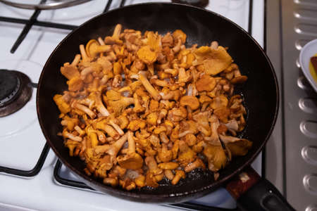 mushrooms on black frying pan top view