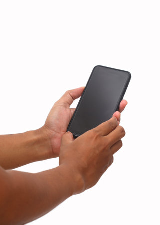 Man's hand holding the black smartphone with blank screen and modern frameless design. Isolated on...