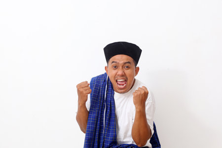 Portrait of happy Asian man celebrates his success. Isolated on white backgroundの写真素材