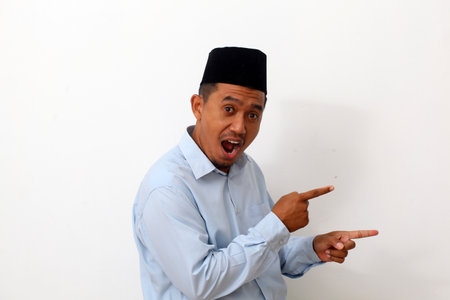 Asian man point to present an empty space of content. Advertising model concept.