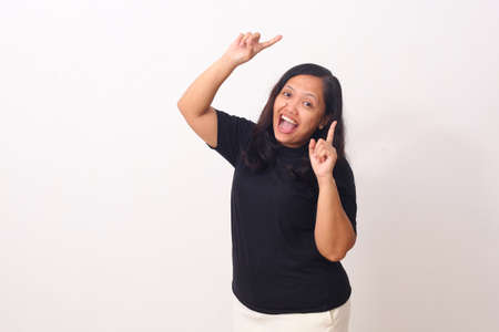 Asian woman dancing and feel happy. Isolated on white background