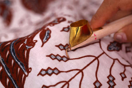 Close up photo of the process of making batik. Batik is a handmade ancient art from Indonesia....