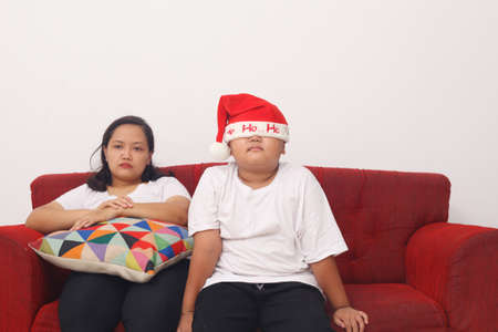 Sad asian mother and her son in christmas seasonの写真素材