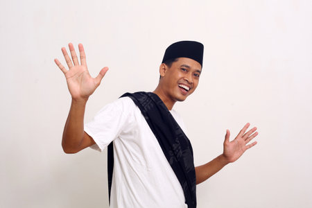 Portrait of happy Asian man celebrates his success. Isolated on white backgroundの写真素材