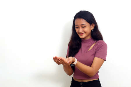 Asian girl asking for blessing by opening both hands isolated on white background