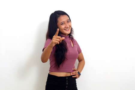 asian young woman pointing to camera choosing you
