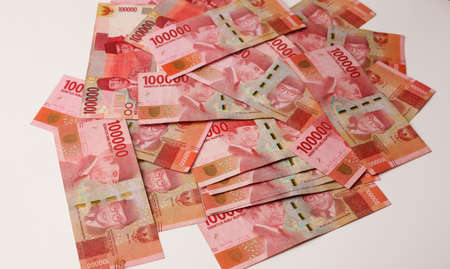 Indonesian rupiah cash banknotes money. Money pile 100000 rupiah bills