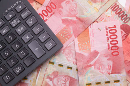 Calculator On Indonesian rupiah cash banknotes moneyの写真素材