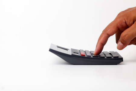 Hand using calculator. Isolated on white background with copyspaceの写真素材