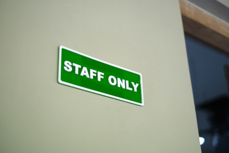 Staff only sign on the wallの写真素材