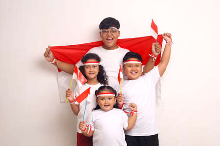 Indonesian kids celebrate independence day. Isolated on white backgroundの写真素材
