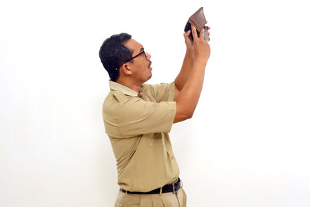 Curious Indonesian government employees standing while checking his wallet. Isolated on white