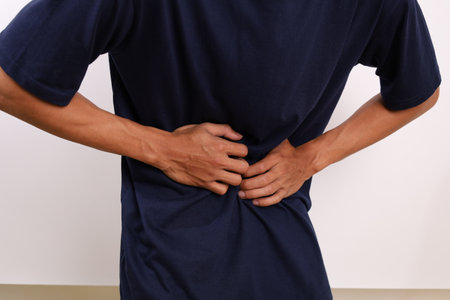 Close up photo of man suffering from stomach ache. Health problem concept. Isolated on white...
