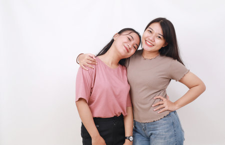 Two young Asian women on white backgroundの写真素材