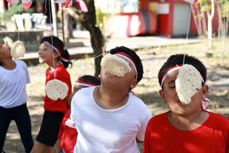 Indonesian kids celebrate Indonesia independence day with outdoor contestの写真素材