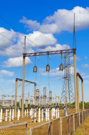 Power lines against the blue sky  with cloudsの写真素材