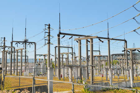 Power lines against the clear blue skyの写真素材