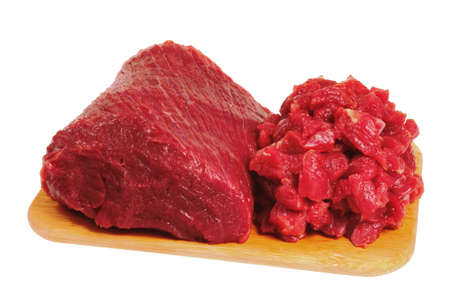 The whole piece and sliced beef, lying on a wooden board. Isolated on whiteの写真素材