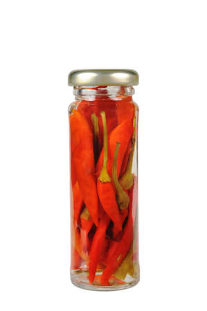 Canned red peppers in a jar. Isolated on whiteの写真素材