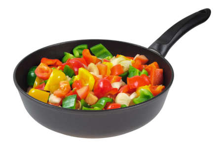 Roasting pan with the vegetables. Red and green peppers, onions, tomatoes. Isolated on whiteの写真素材