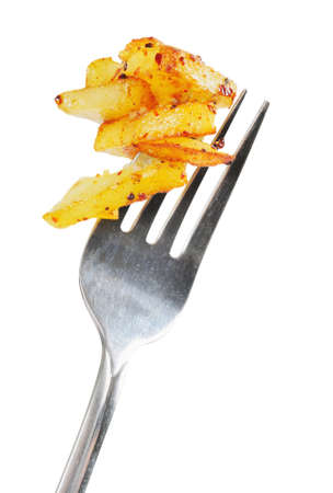 Fried potatoes  on  a fork.  Isolated  on white.の写真素材