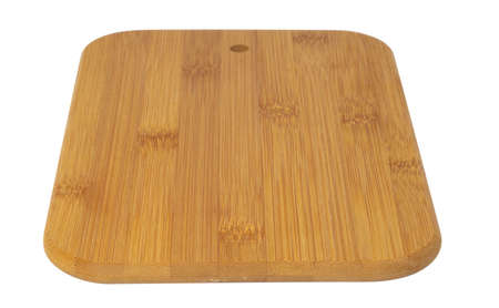 Wooden cutting board isolated on white backgroundの写真素材