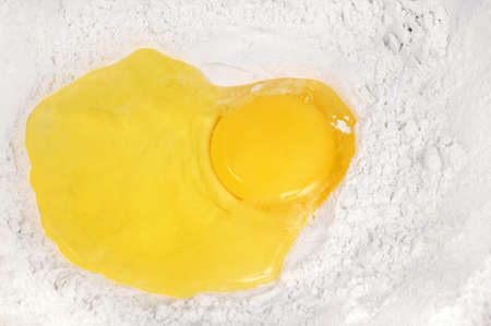 Broken eggs  in the flour. Close upの写真素材