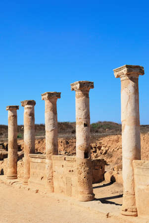 Ancient Greek columns in the ruins against a blue sky.の写真素材