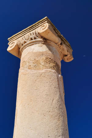 Ancient Greek columns in the ruins against a blue sky.の写真素材
