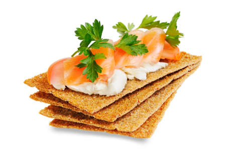 Snack. Bread with feta cheese and salmon. Isolated on white.の写真素材