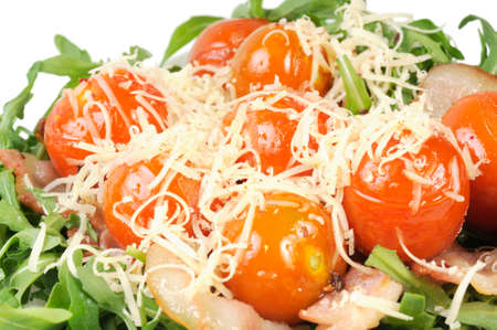 Salad with arugula and tomatoes  Isolated on white の写真素材