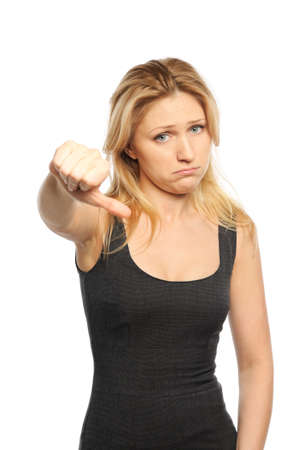 Young attractive girl shows gesture thumb down  Isolated on white の写真素材