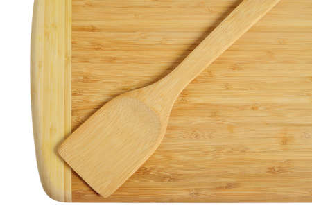 Wooden kitchen board with a spatula  Isolated on white background の写真素材