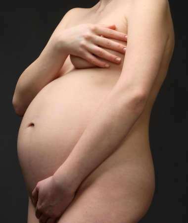close up view of a pregnant woman's stomachの写真素材