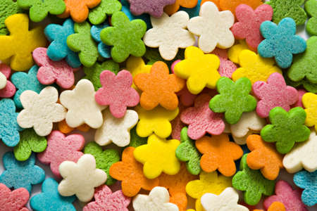 Confectionery ornaments in the form of multi-coloured florets close upの写真素材
