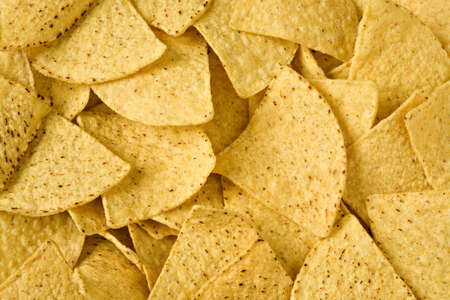 Yellow triangular chips close up in all shot