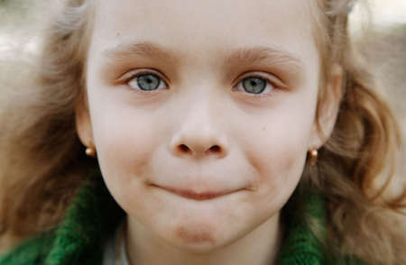 Portrait of the cheerful little girl の写真素材