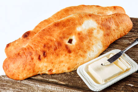 Lavash, Georgian bread and butter on wooden boardの写真素材