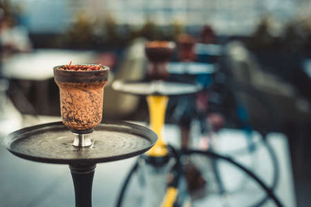 Group of hookahs shisha on table in interior