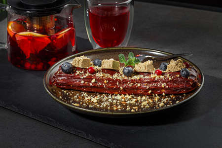 Traditional french eclairs with chocolate. Chef cuisine