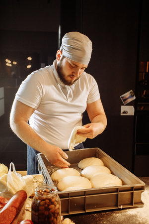 Pizza dough in a box, cheking yeast riseの写真素材
