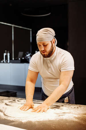 Making dough by hands at bakery or at home.の写真素材