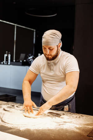 Making dough by hands at bakery or at home.の写真素材