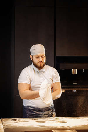 Making dough by hands at bakery or at home.の写真素材