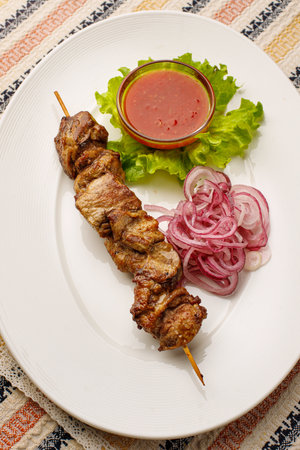 Shashlik on a wooden skewer, top view, closeupの写真素材