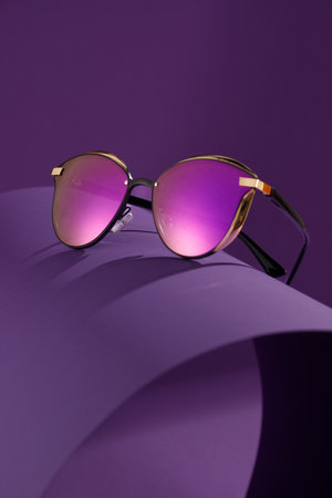 Trendy sunglasses background. Fashion summer accessories. Copy space for text. Pink concept. Optic store discount posterの写真素材