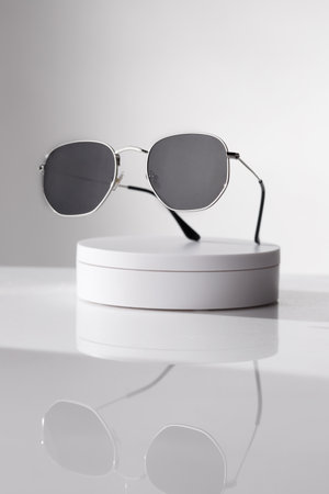 Trendy sunglasses background. Fashion summer accessories. Copy space for text. Black white concept. Optic store discount posterの写真素材