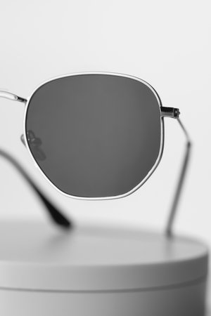 Trendy sunglasses background. Fashion summer accessories. Copy space for text. Black white concept. Optic store discount posterの写真素材